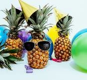 Lifeside photo of three pineapples surrounded by balloons 1071882